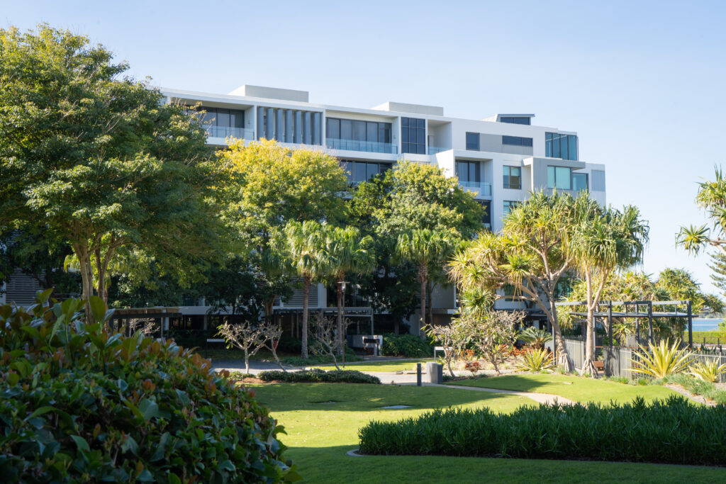 Maintained gardens and mature trees at Allisee Residential Apartments, Hollywell